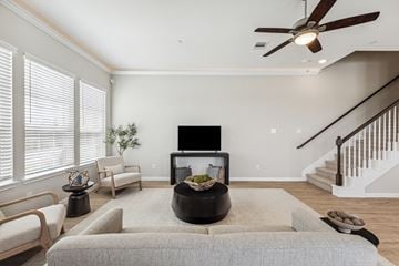 Texas City townhouse for rent - A living room with a grey couch and a black coffee table.