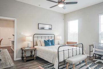 Montgomery townhouse for rent - a bedroom with a bed and a ceiling fan