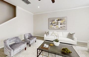 Houston townhouse for rent - a living room with a couch and chairs and a table