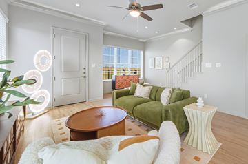 Kyle townhouse for rent - A living room with a green couch and a wooden table.