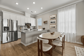 Texas City townhouse for rent - A modern kitchen with a dining table and chairs.