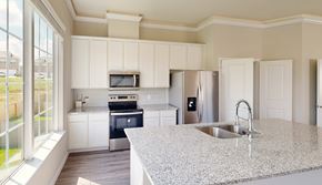Montgomery townhouse for rent - A kitchen with a granite countertop and stainless steel appliances.