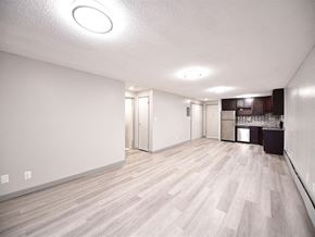 Bristol apartment for rent - an empty living room and kitchen with wood flooring