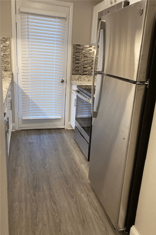 Wallingford apartment for rent - a kitchen with a refrigerator and a door