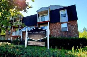 New London apartment for rent - an apartment building with a sign in front of it