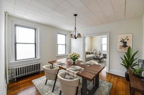 New London apartment for rent - a dining room with a wooden table and chairs