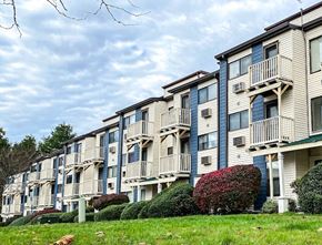 Wallingford apartment for rent - Exterior View of Silvertree Apartments showing private2-story and 3-story balconies and green space