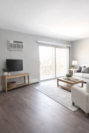 Cincinnati apartment for rent - A living room with a flat screen TV mounted on the wall.