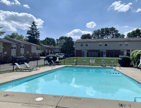 Cincinnati apartment for rent - A pool surrounded by apartment buildings and a "No Diving" sign.