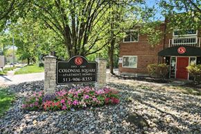 Cincinnati apartment for rent - A sign for Colonial Square Apartment Homes is in front of a brick building.