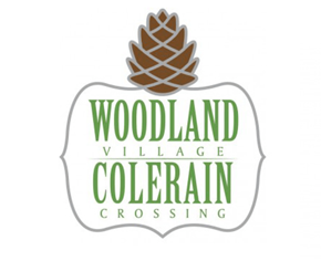Cincinnati apartment for rent - A logo with a pine cone on top and the words "Woodland Village Colerain Crossing" written below it.