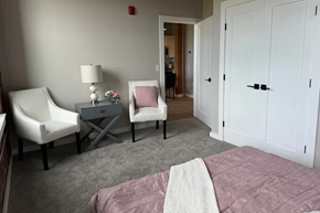 Nashua apartment for rent - a bedroom with a bed and two chairs and a table