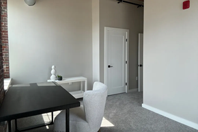 Nashua apartment for rent - a dining room with a table and chairs and a door