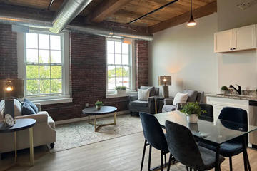 Nashua apartment for rent - an open living room with a dining room table and a couch