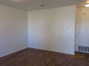 Cheyenne apartment for rent - an empty living room with white walls and wooden floors