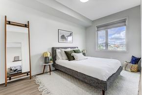 Edmonton apartment for rent - an apartment bedroom with a bed and a window