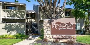 Martinez apartment for rent - A sign for Ridgecrest Apartment Homes stands in front of a building.