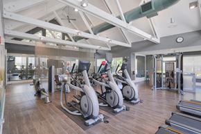 Hillsboro apartment for rent - A gym with a variety of exercise equipment including treadmills, stationary bikes, and weight machines.