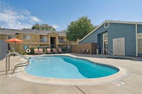 Pittsburg apartment for rent - A small pool with a metal fence around it.