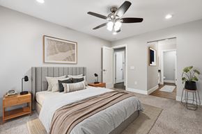 Martinez apartment for rent - A bedroom with a large bed and a ceiling fan.