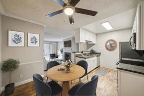 Campbell apartment for rent - A dining room with a table and chairs and a ceiling fan.