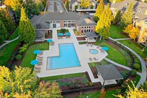 Hillsboro apartment for rent - A large backyard with a pool and a deck.