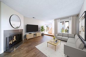 Alta Loma apartment for rent - A modern living room with a fireplace and a television.