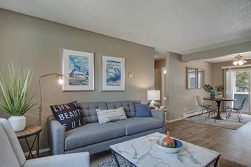 Sparks apartment for rent - A living room with a grey couch and a coffee table.