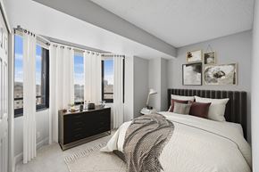 San Francisco apartment for rent - A bedroom with a large bed and a window with curtains.