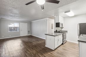 Alameda apartment for rent - an empty kitchen and living room with a stove and refrigerator
