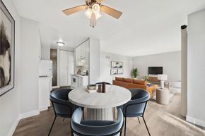 Alameda apartment for rent - A modern dining room with a round table and chairs.