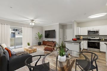 Antioch apartment for rent - A modern living room with a black couch and a wooden coffee table.