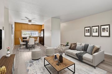 Concord apartment for rent - A living room with a white couch and a wooden coffee table.