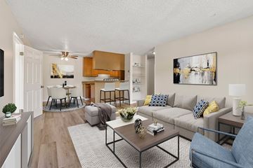 Concord apartment for rent - A living room with a grey couch and a coffee table.