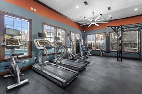 Reno apartment for rent - A gym with treadmills, elliptical machines, and a punching bag.