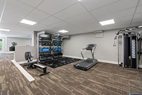 Walnut Creek apartment for rent - A gym with a treadmill, weights, and exercise equipment.