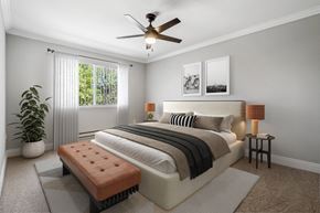 Martinez apartment for rent - A bedroom with a large bed, a bench, and a potted plant.