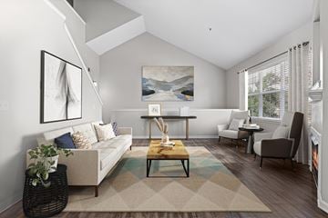 Greenwood Village apartment for rent - A living room with a couch, chairs, and a painting on the wall.