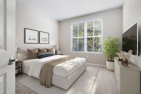 Concord apartment for rent - a bedroom with a bed and a large window