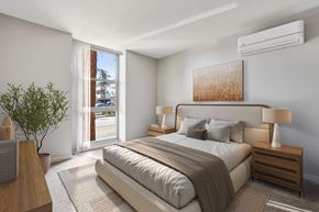 Walnut Creek apartment for rent - A bedroom with a large bed, a nightstand with a lamp, and a plant.