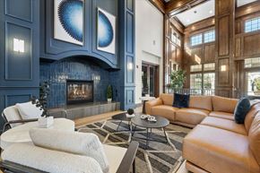 Reno apartment for rent - A living room with a fireplace and a couch.