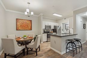 Vacaville apartment for rent - A kitchen with a dining table and chairs.