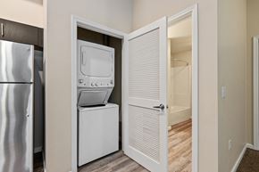 Fairfield apartment for rent - A white refrigerator is in a kitchen next to a white door.
