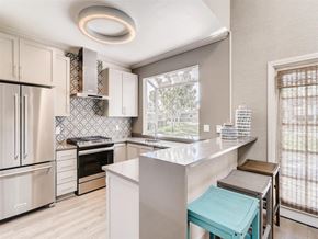 Laguna Niguel apartment for rent - A kitchen with a white counter and a blue stool.
