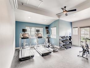 Laguna Niguel apartment for rent - A spacious gym with treadmills, elliptical machines, and a fan.