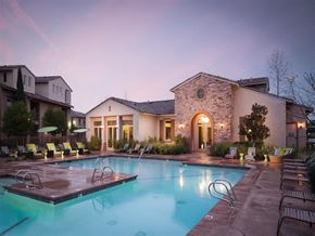Roseville apartment for rent - A large house with a pool in front.