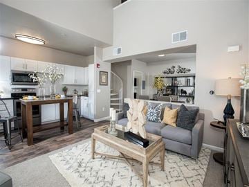 Roseville apartment for rent - A living room with a grey couch and a coffee table.