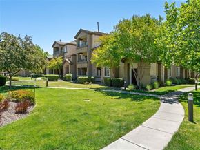 Sacramento apartment for rent - A residential area with apartment buildings and a sidewalk.