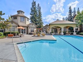 San Jose apartment for rent - A large house with a pool in front.