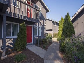 Santa Rosa apartment for rent - A building with a red door and a walkway in front.